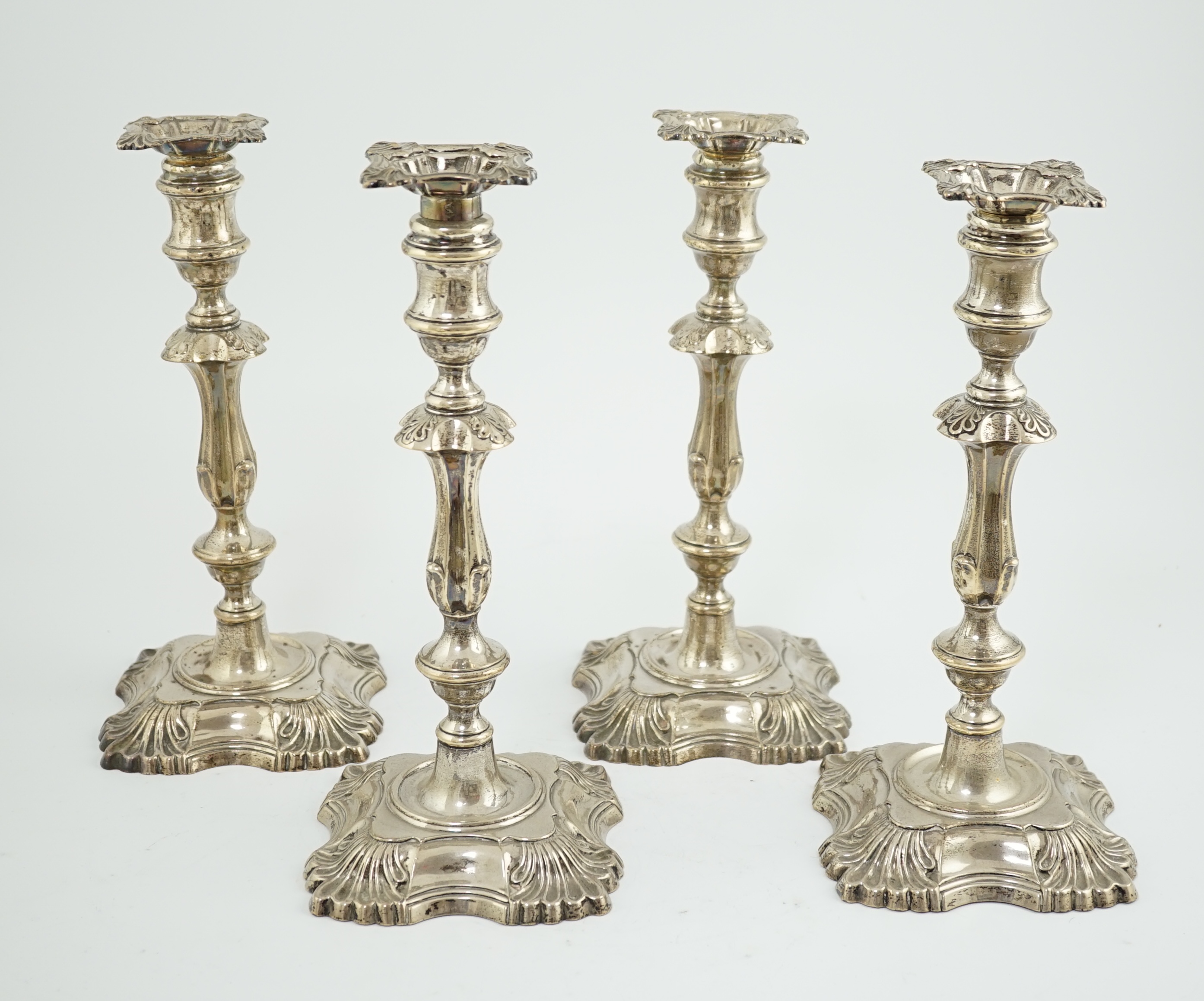 A matched set of four late Victorian/Edwardian silver candlesticks, by William Hutton & Sons Ltd